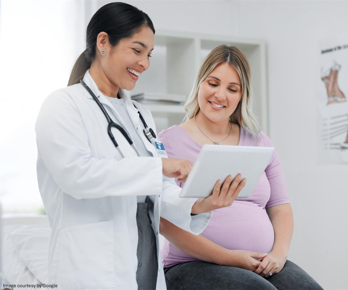 Doctor showing report to a pregnant