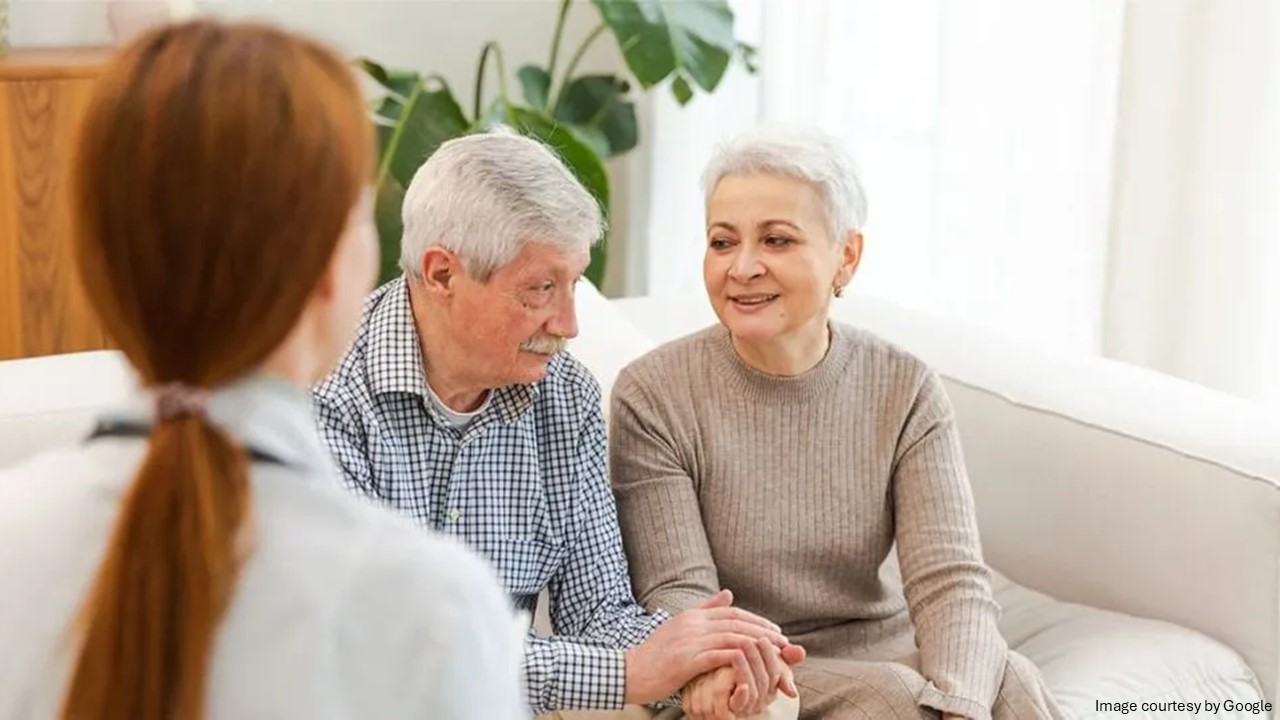 Elder couple holding each other hand