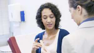women discussing with doctor