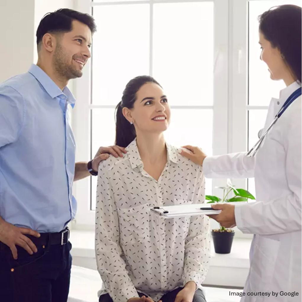 Doctor talking about birth control with a couple