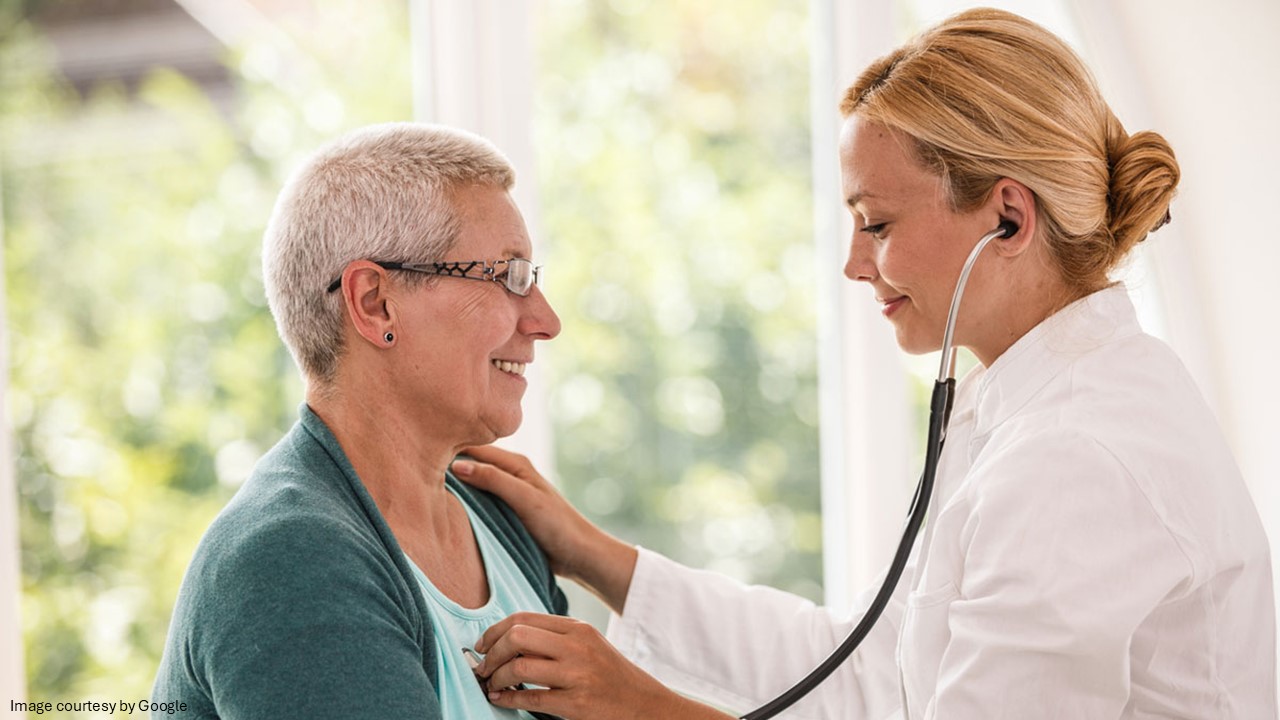 Doctor checking heart beat of the patient