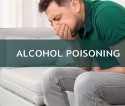 A person with alcohol poisoning covering his mouth