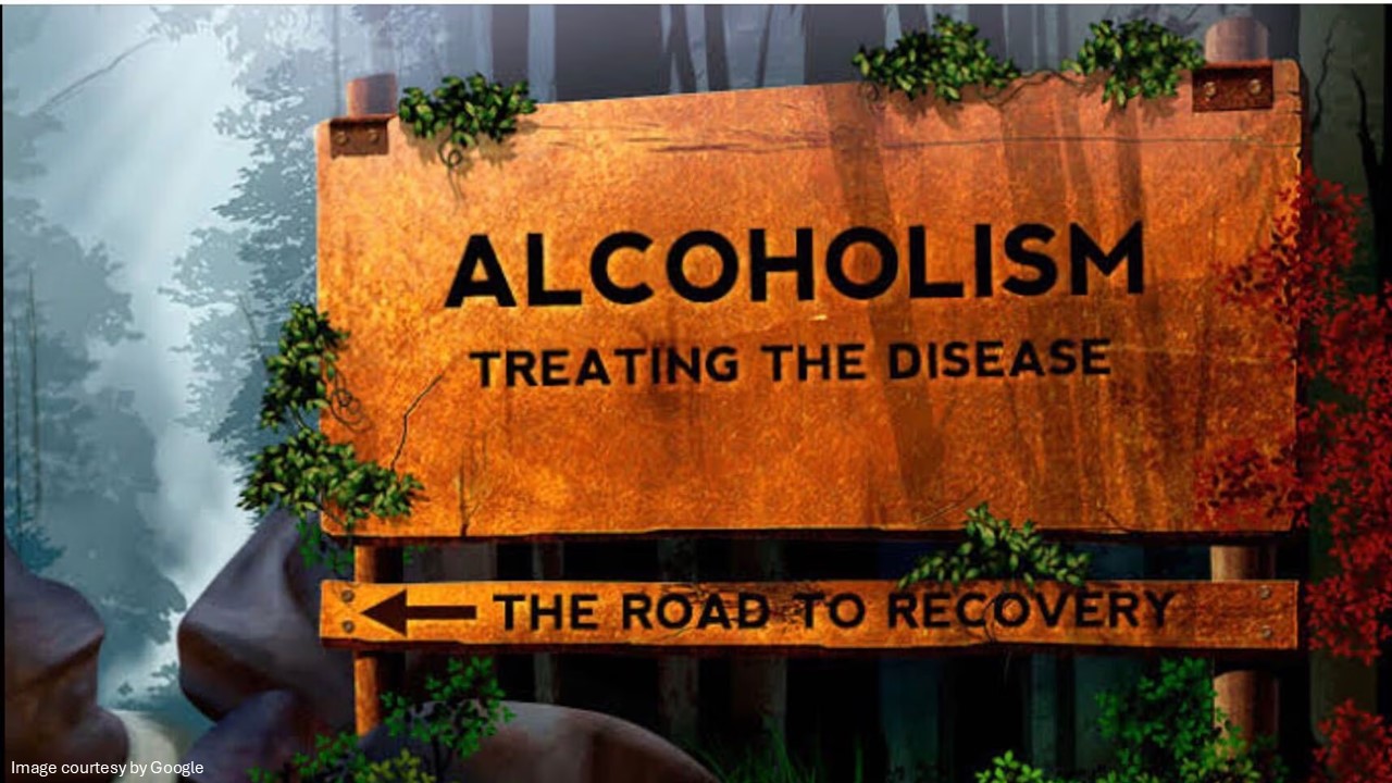 A board with alcoholism treating the disease written on it