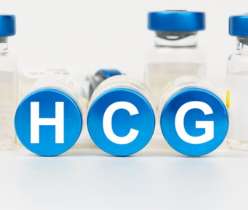 HCG written with a vaccine behind it