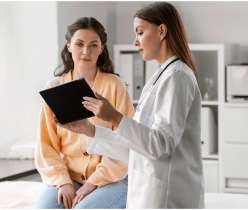 Doctor discussing hcg levels with the women​