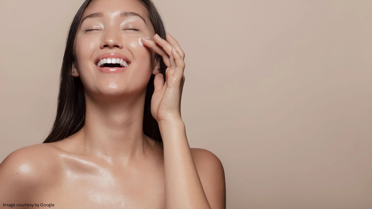 Girl applying skincare product 