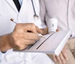 Doctor writing prescription