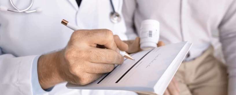 Doctor writing prescription