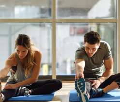 Two people doing stretching exercise