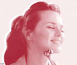 A face of a girl using a face roller