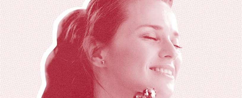 A face of a girl using a face roller