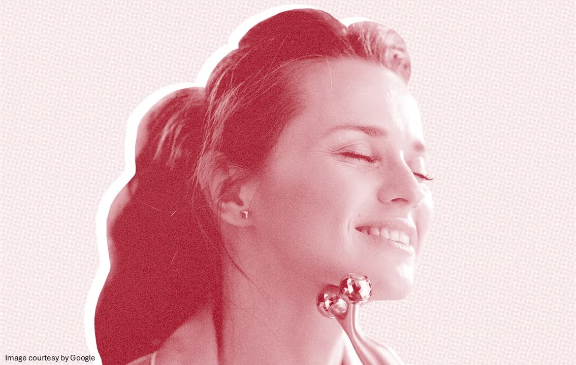 A face of a girl using a face roller