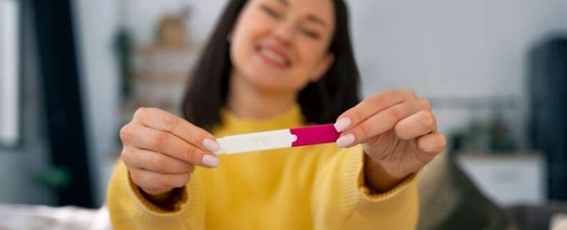 Lady holding a pregnancy strip