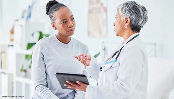 doctor consulting patient suffering from acidity